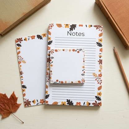 Leaves and acorns border stationery in an autumn workspace flat lay