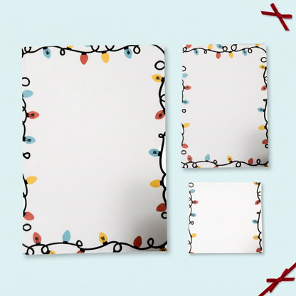 Christmas Lights stationery on a pale icy-blue background