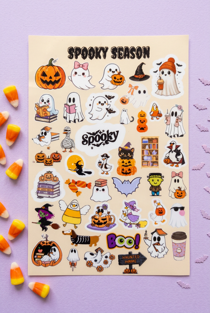 Spooky Season Halloween sticker sheet flat lay on a pale lavender background with candy corn and bat confetti