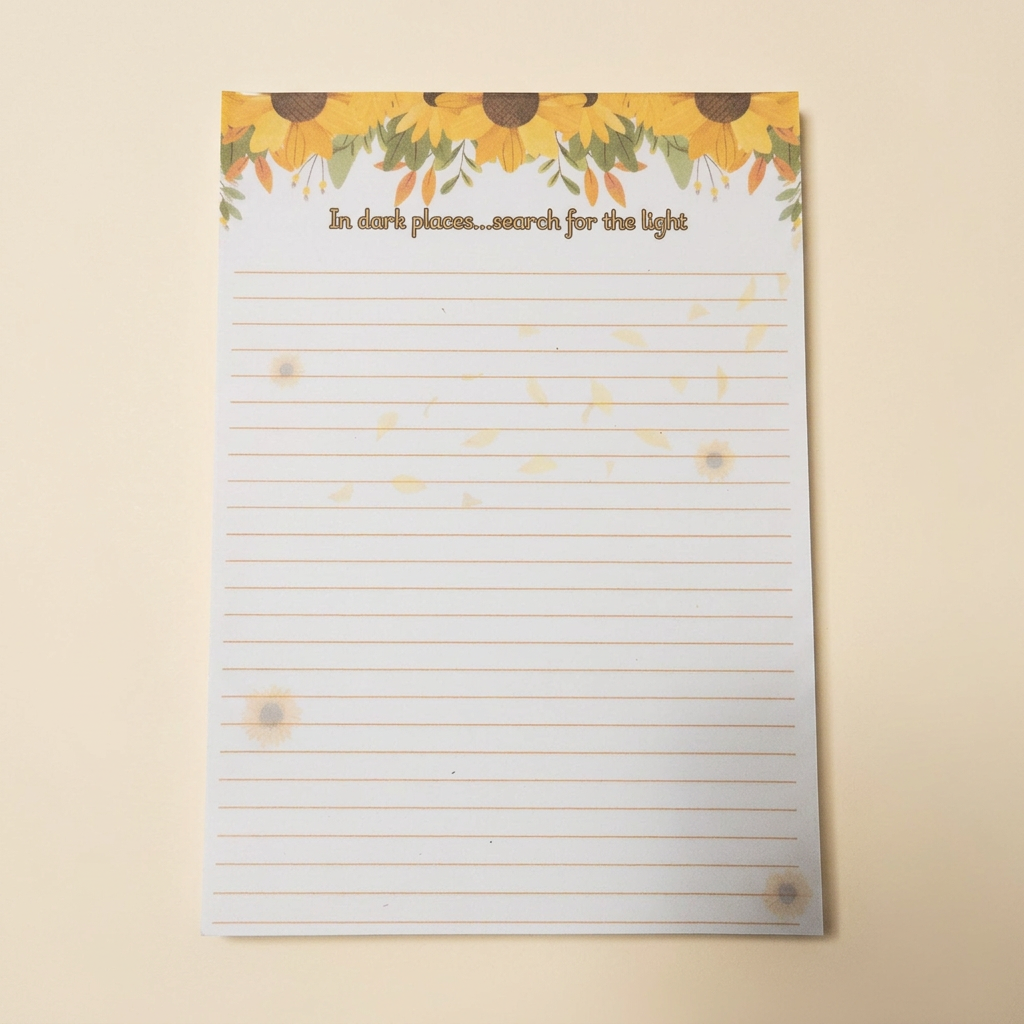Individual sunflower notepad on a soft cream background