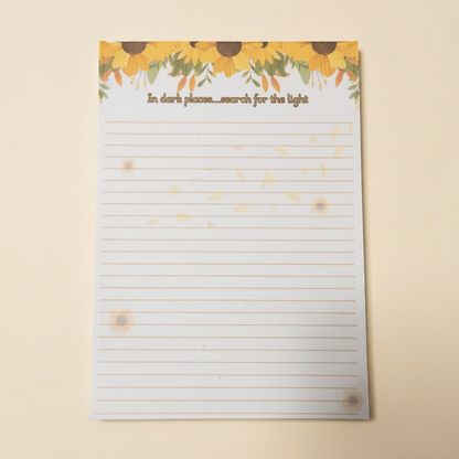 Individual sunflower notepad on a soft cream background