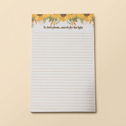 Individual sunflower notepad on a soft cream background